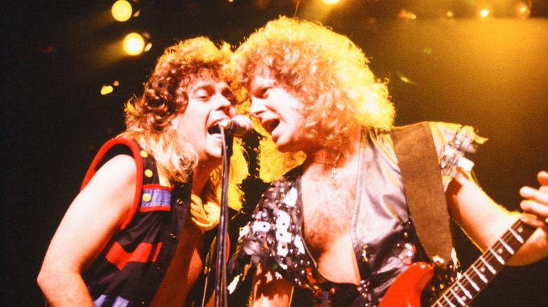 Jack Blades and Brad Gillis performing