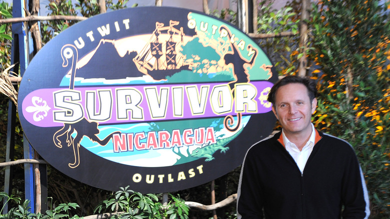 Mark Burnett in front of "Survivor" sign