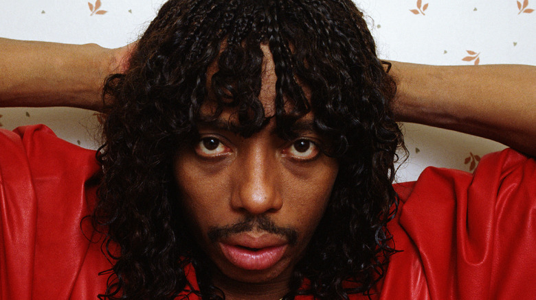 Rick James wearing red shirt