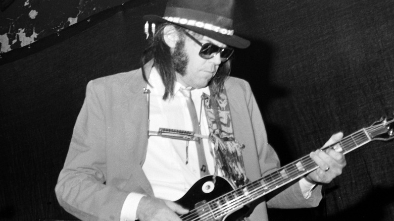 Neil Young performing in concert