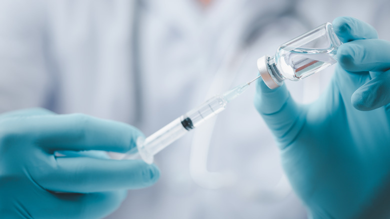 doctor syringe vial