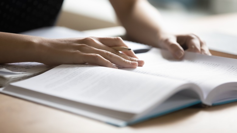 Person studying a textbook