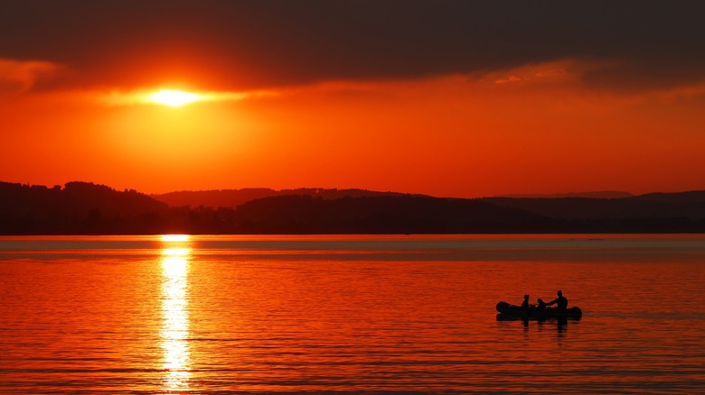 Setting sun over body of water