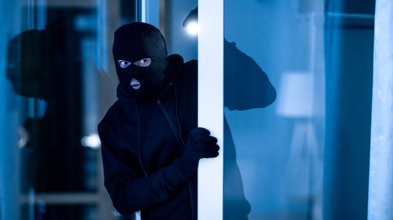 thief opening door