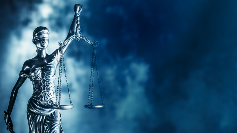 woman holding scales of justice