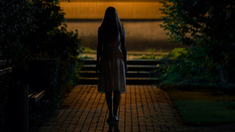 Woman walking alone at night