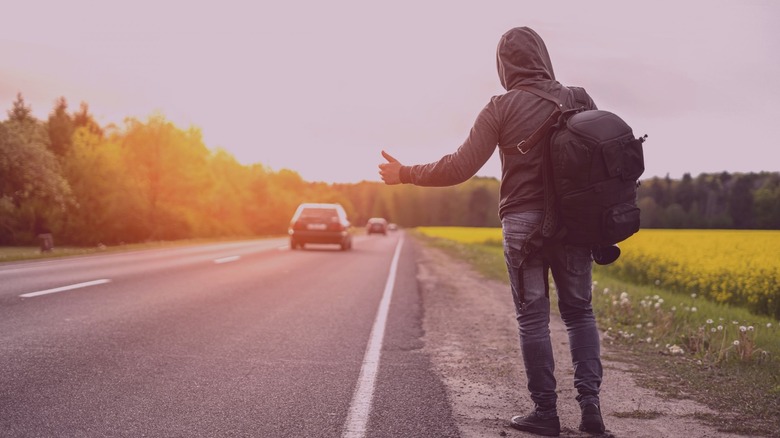 hitchhiker with thumb out