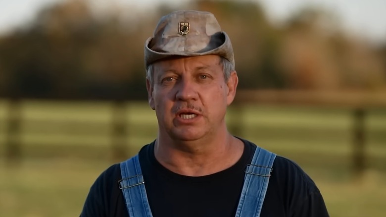 tim smith in hat and dungarees