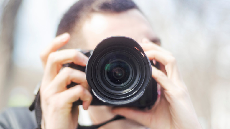 Man aiming a camera