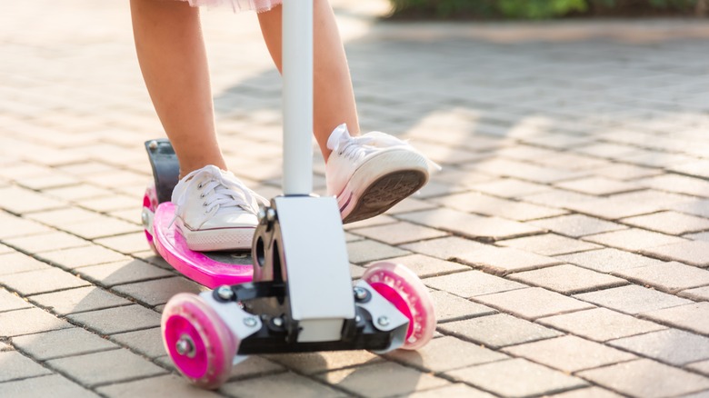 Child on scooter 