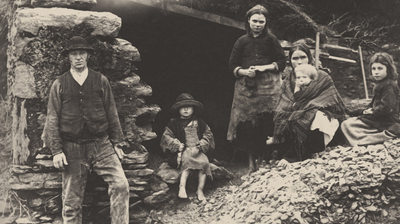 Irish family outside their house