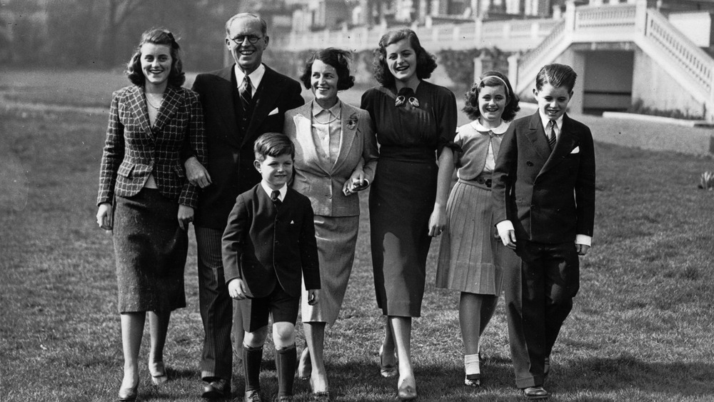 Group shot of Kennedy family smiling and walking