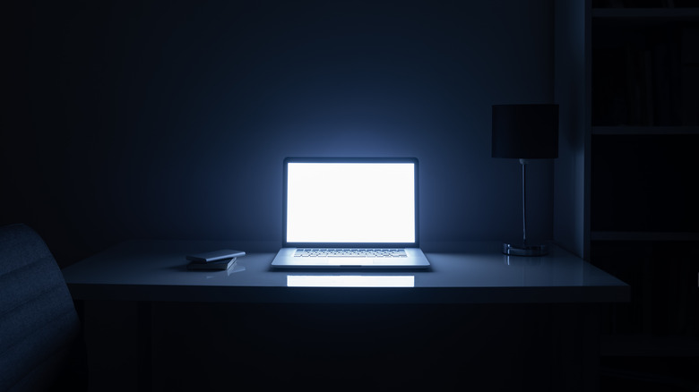 Room illuminated by a laptop
