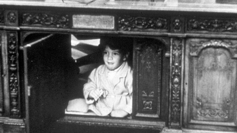 John Jr. playing under the desk