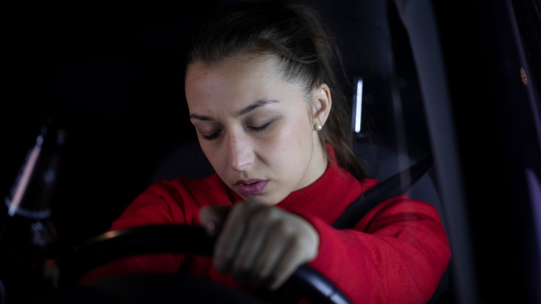 woman sitting alone in car