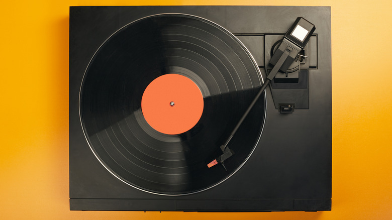 A record player on a yellow background