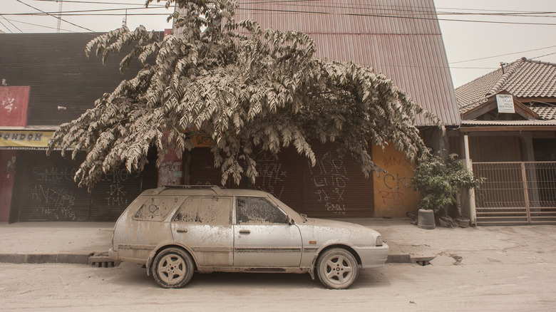 ash covered street after volcanic eruption