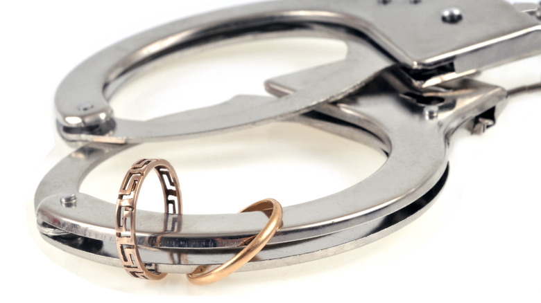 wedding rings on handcuffs