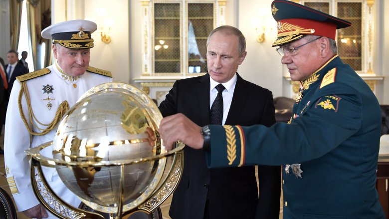 Vladimir Putin with military men around globe
