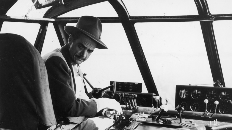 Howard Hughes sitting in the Spruce Goose