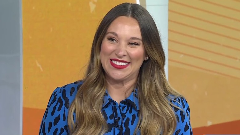Ashley Flowers smiling during interview