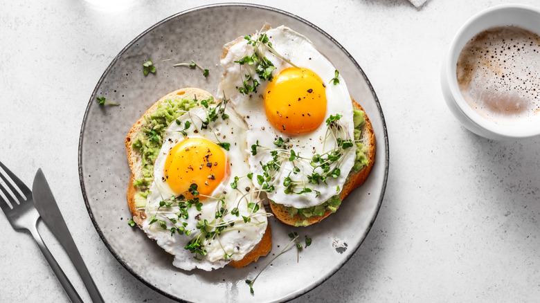 plate of eggs on avacado toast