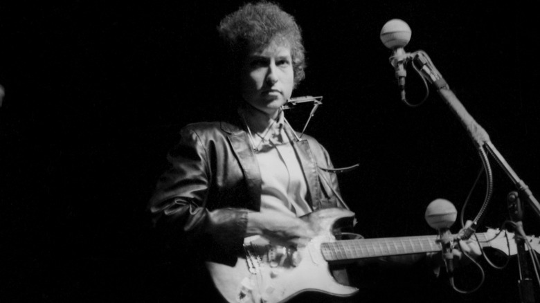 Bob Dylan plays electric guitar at Newport Folk Festival