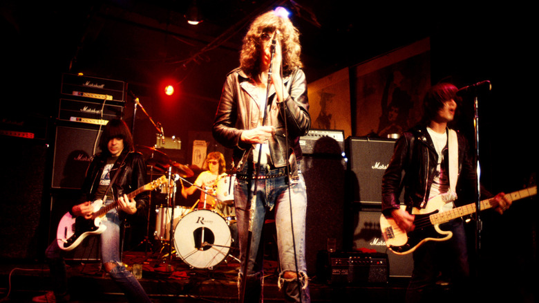 The Ramones performing on a small stage