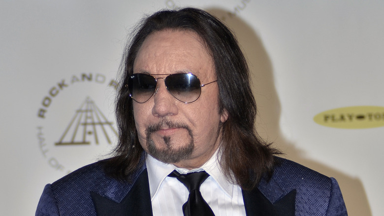 ace frehley smirking and looking away