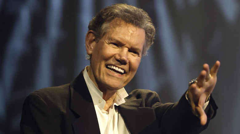randy travis smiling and waving