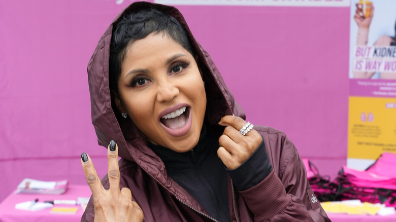 toni braxton in hood making peace sign