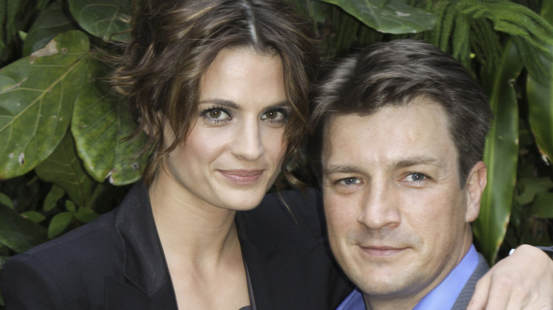 Stana Katic embracing Nathan Fillion