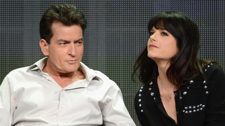 Charlie Sheen and Selma Blair looking away during panel talk