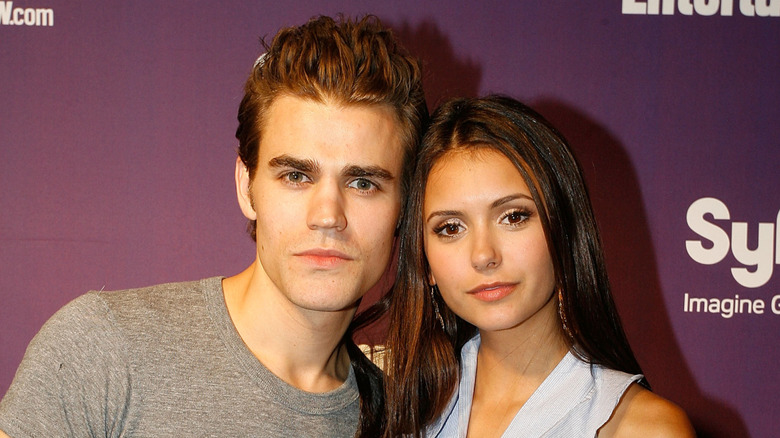Paul Wesley and Nina Dobrev holding heads together awkwardly