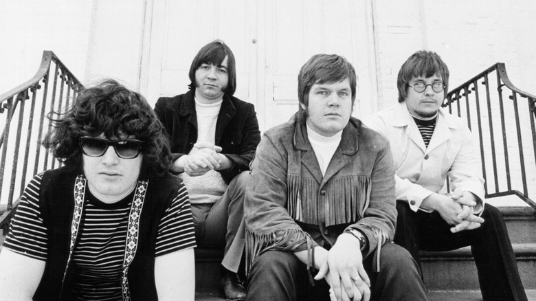 The Guess Who sitting on steps in a mid-1960s publicity shot