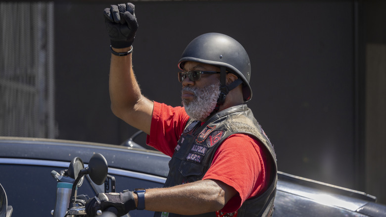 Motorcyclist with fist in the air