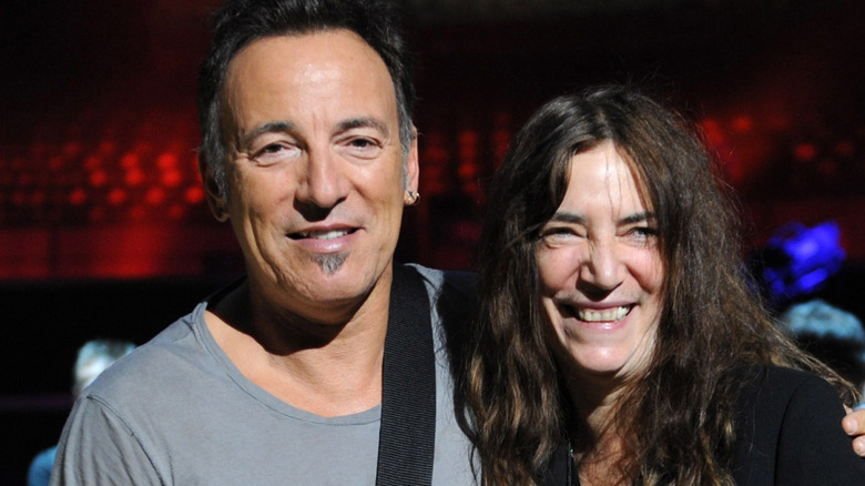 Bruce Springsteen smiling with Patti Smith