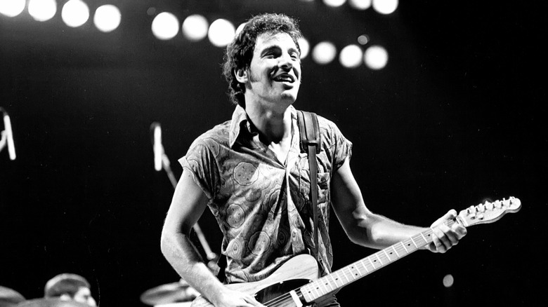 Bruce Springsteen playing electric guitar onstage