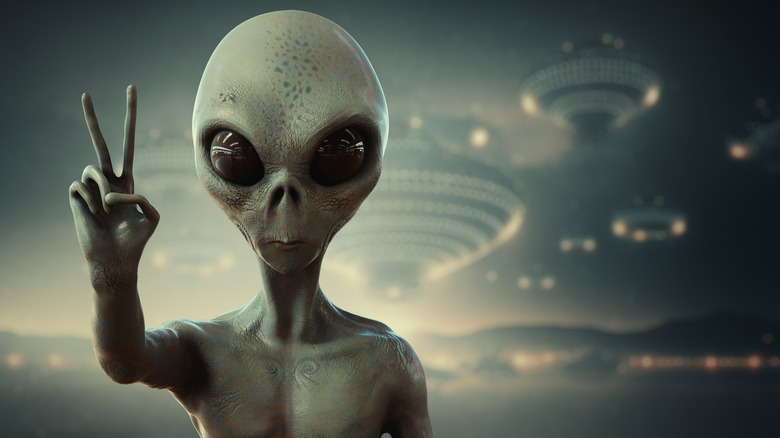 Alien giving peace sign
