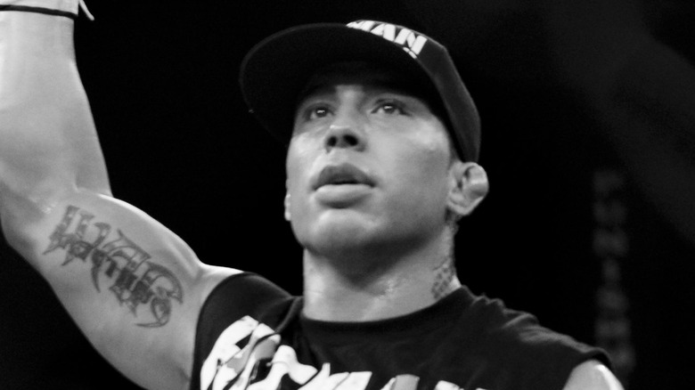 Jonathan 'War Machine' Koppenhaver arm raised hat