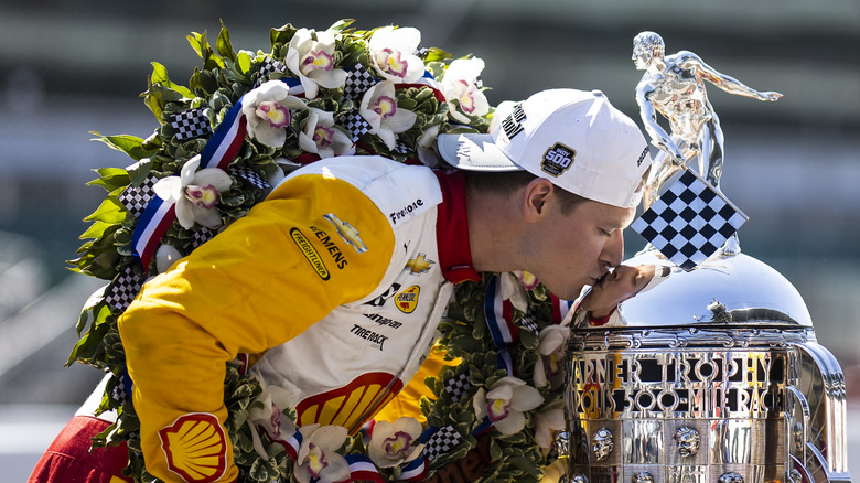 Newgarden kisses trophy