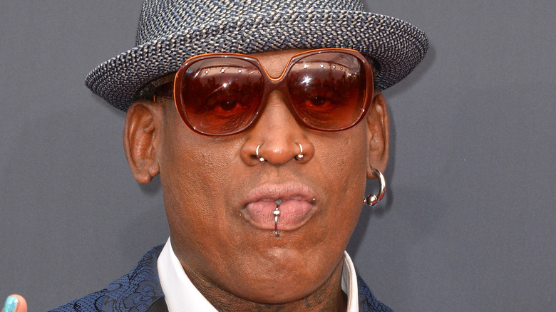 dennis rodman in hat and sunglasses