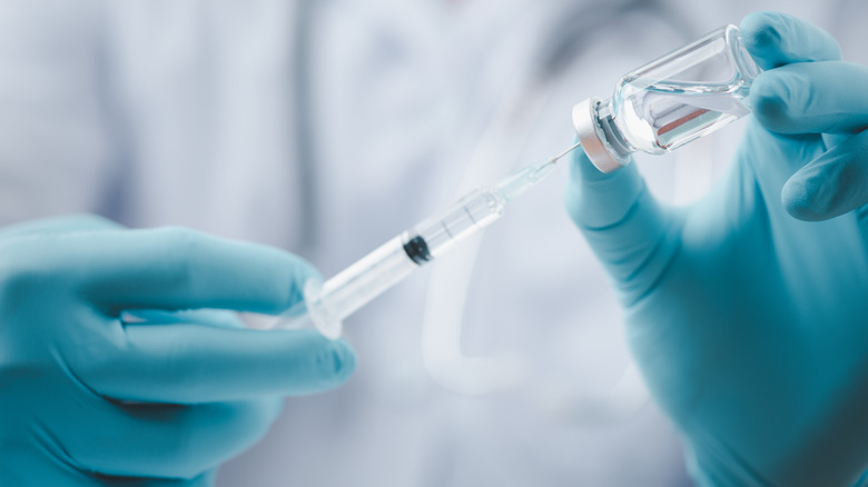 Syringe in a doctor's hands