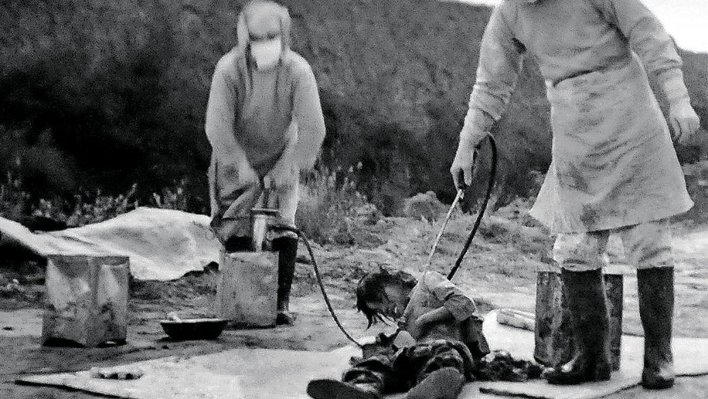 Shows personnels of 'Manchukuo' attend a 'plague prevention' action which indeed is an bacteriological test directed by Japan's 'Unit 731' in November of 1940 at Nong'an County, northeast China's Jilin Province.