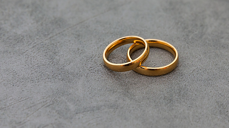 Two wedding bands gray background
