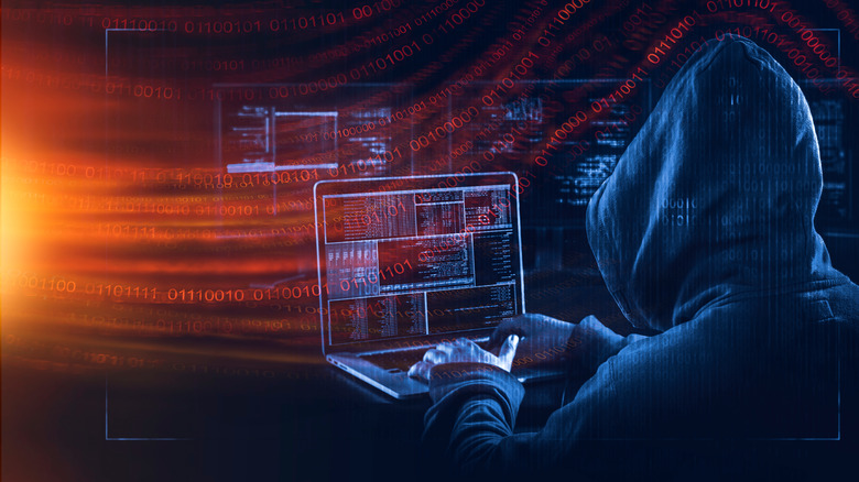 Hooded figure hacking