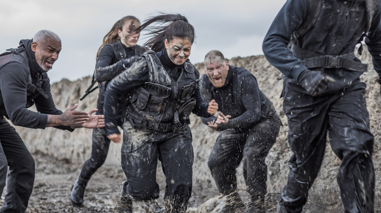 Military operatives doing a mud run