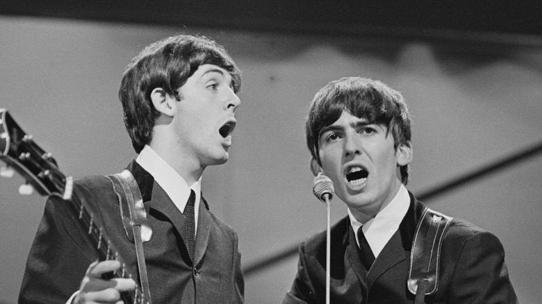 Paul McCartney and George Harrison singing