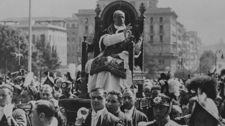 Pius XII is carried as he blesses the crowd