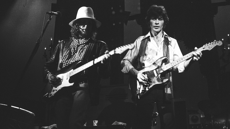 Dylan Robertson playing guitar hat
